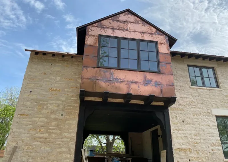 Copper metal panel facade on a stone building for Skylight Installation in Richmond Heights